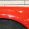 57_086d0fbf-5eb7-4115-b33c-b96aaccb0fd0 1999-2004 Ford Mustang GT Left Fender XR3Z16006AA Performance Red ES XR3Z16006AA