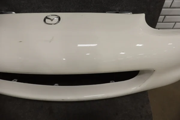 57_1b562d61-eef1-4ccc-9967-7171b704a45c 1999-2000 Mazda MX-5 Miata Front Bumper White PT