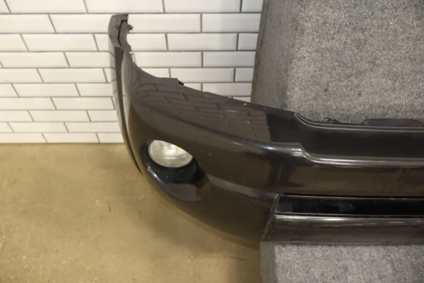 57_58e0fed7-5f83-4694-b2db-4691db53135b 05-11 Toyota Tacoma Base Model Front Bumper Cover W/Fog Lights & Rebar *Damage*