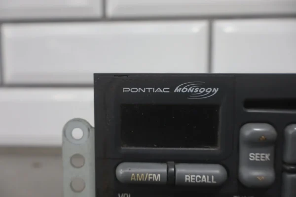 57_b6b5d95f-e74f-45e6-a3fe-ff06b8a526e7 1997-2002 Pontiac Firebird Trans AM Radio OEM Monsoon - CD Player Inoperative